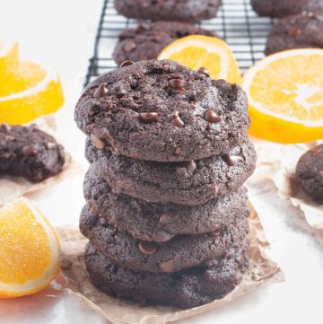 gluten-free-dairy-free-chocolate.orange.cookies-stacked-with-orange-slices-all-around