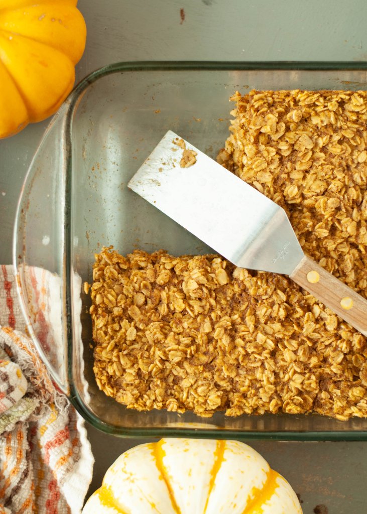 allergy-friendly-baked-pumpkin-oatmeal-in-the-pan-with-a-piece-cut-out