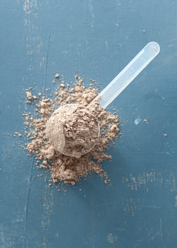 chocolate-pea-protein-powder-in-a-scoop