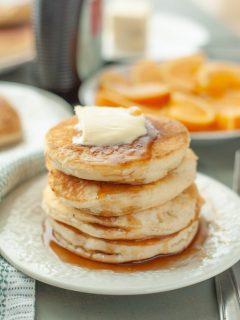 gluten-free-vegan-pancake-stack-with-butter-and-syrup-running-down