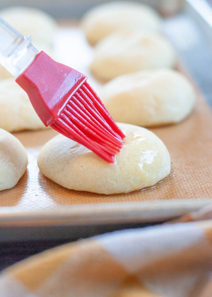 pan-de-bono-getting-melted-butter-brushed-on-top