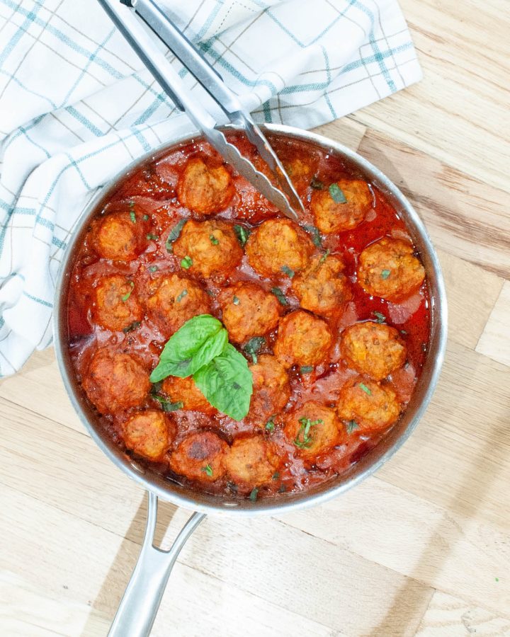 overhead-shot-of-gluten-free-meatballs-sitting-in-marinara-sauce-in-a-skillet