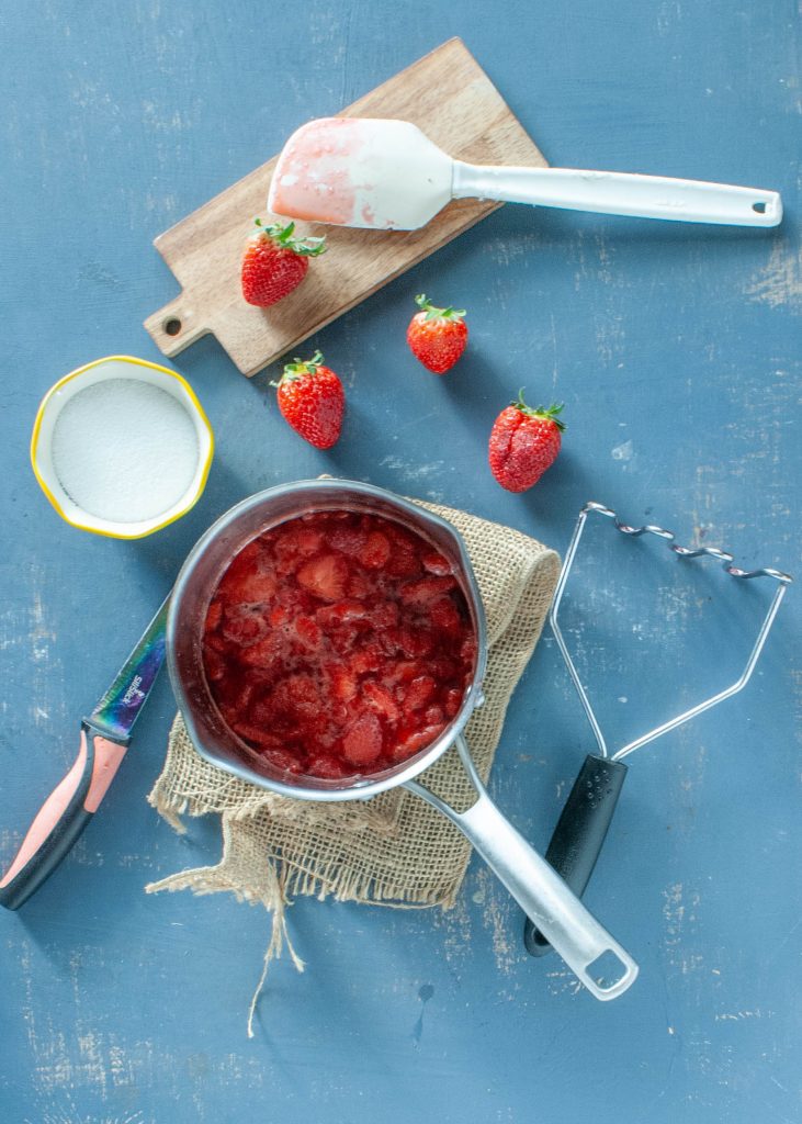low-sugar-strawberry-compote-in-a-sauce-pan-overhead