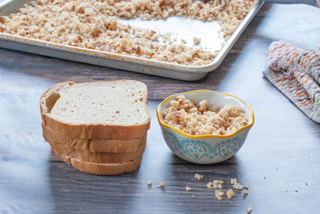 sliced-bread-sitting-next-to-a-bowl-of-gluten-free-breadcrumbs