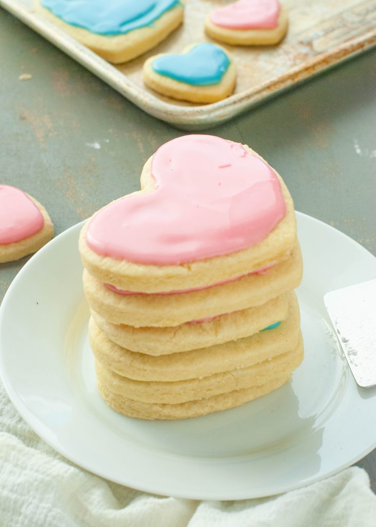 pink-heart-shaped-gluten-free-sugar-cookies-stacked-on-top-of-each-other