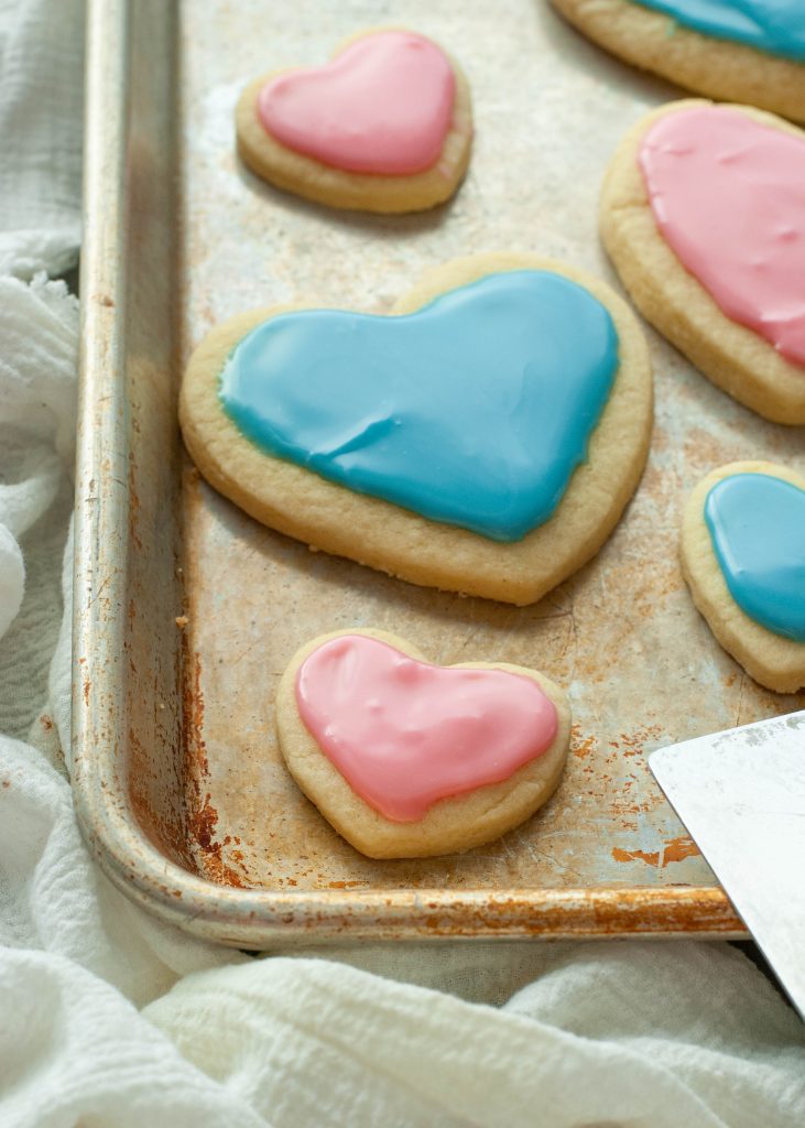 heart-shaped-gluten-free-sugar-cookies-on-the-corner-of-a-baking-sheet
