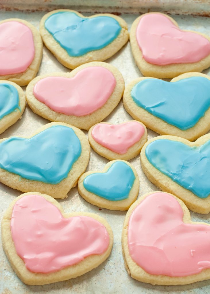 pink-and-blue-gluten-free-sugar-cookies-on-a-baking-sheet