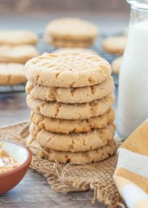 gluten-free-peanut-butter-cookies-stacked-by-a-glass-of-milk