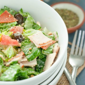 italian chopped salad close up in a white bowl