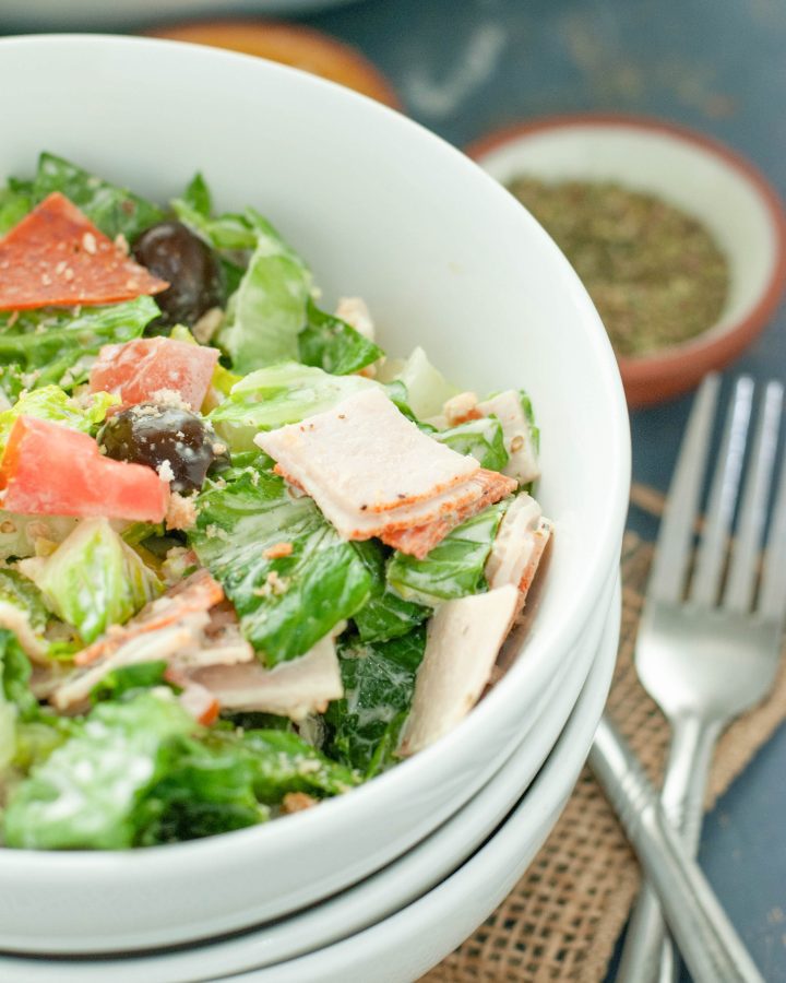 italian chopped salad close up in a white bowl
