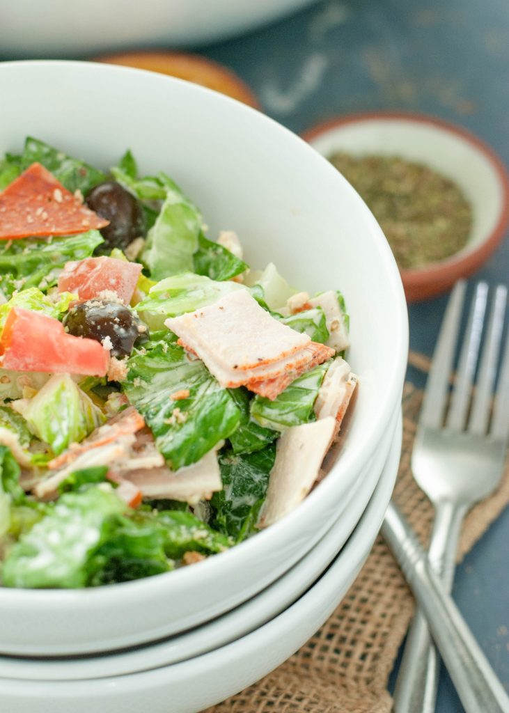 italian chopped salad close up in a white bowl