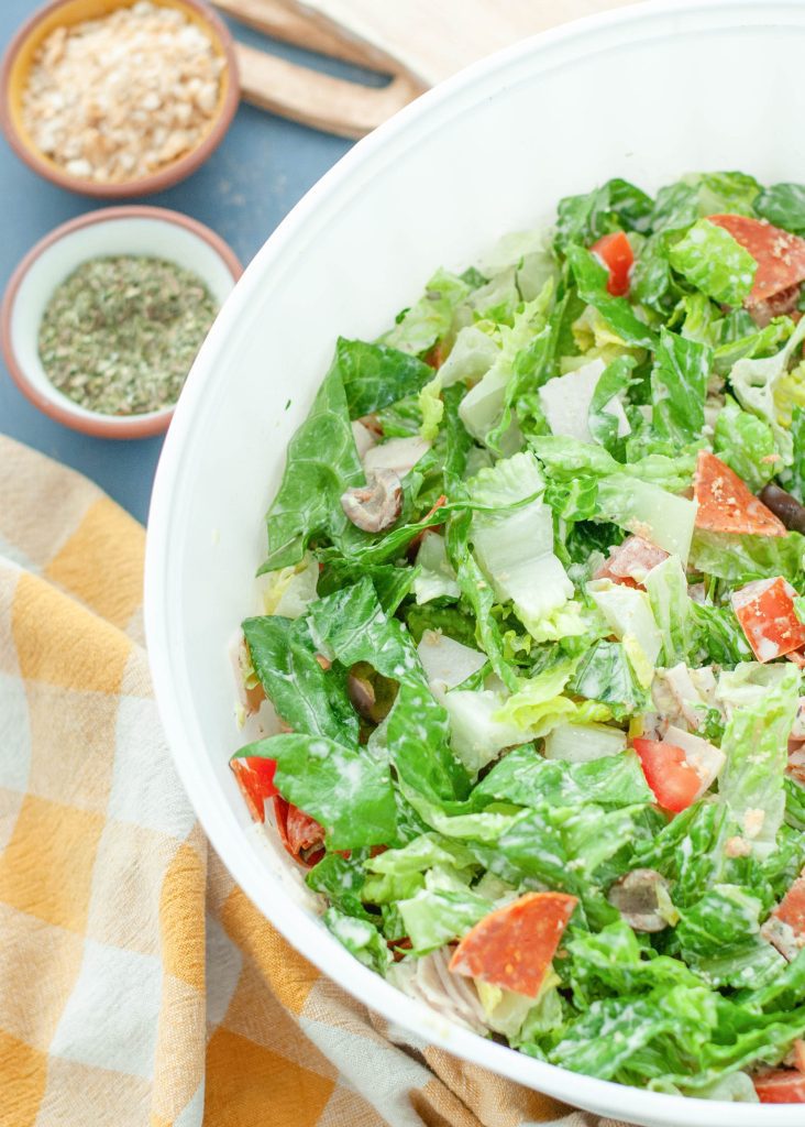 creamy-italian-green-salad-in-large-white-serving-bowl