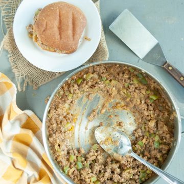 gluten-free-dairy-free-philly-cheesesteak-mixture-in-a-skillet-with-a-bun-on-a-plate